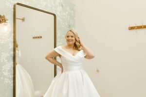 woman wearing a classic off the shoulder wedding dress